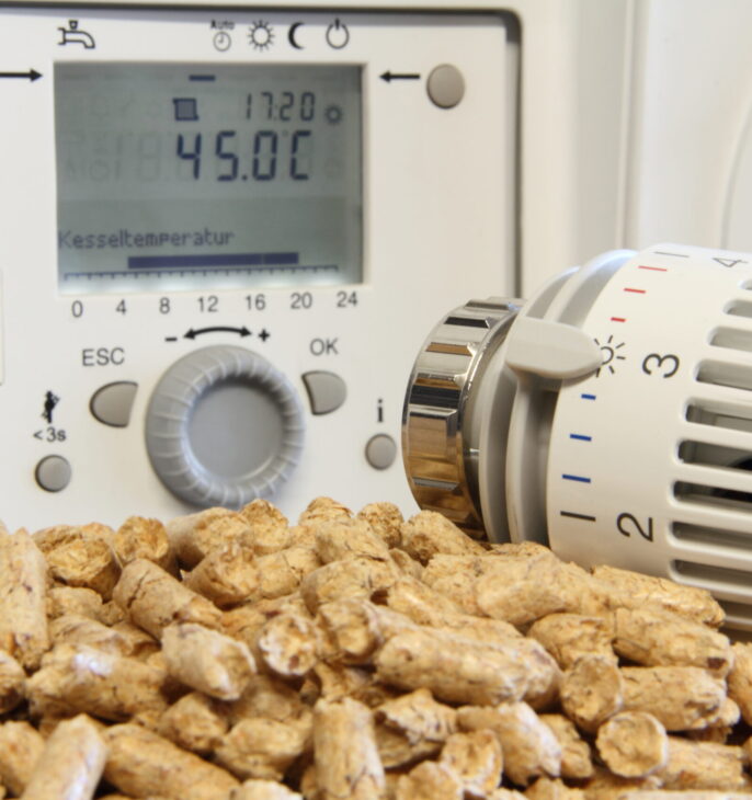Thermostat de chauffage avec granul&eacute;s de bois et vanne thermostatique pour syst&egrave;me de chauffage domestique.