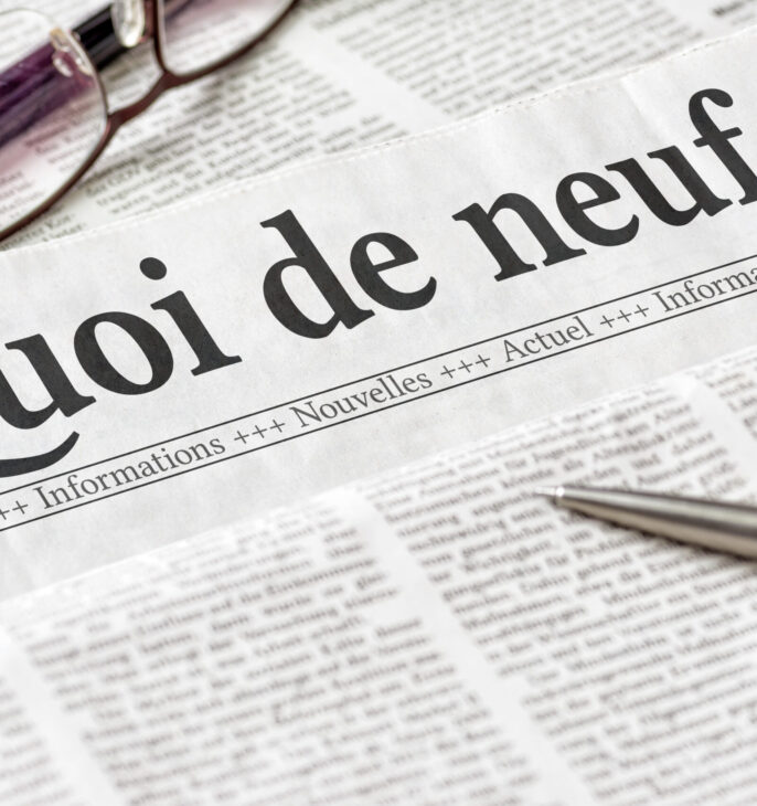 journal de presse avec gros titre : Quoi de neuf?